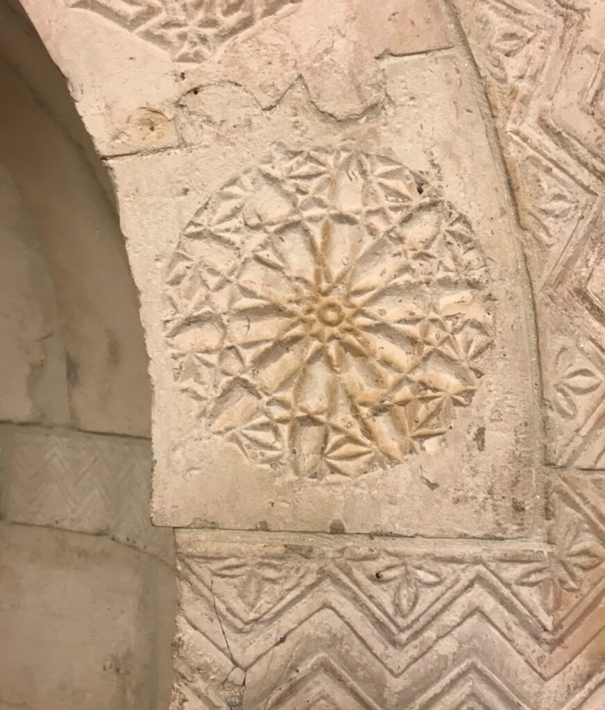 Geometric and floral decorations around the mihrab
